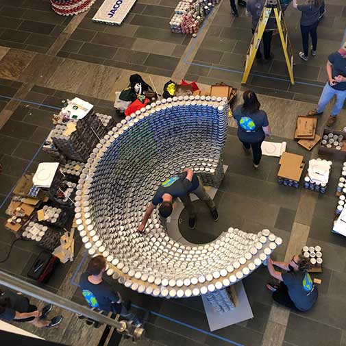 A shot of the DCBA-SMMA team with our 9000+ can sculpture for CANstruction Boston’s charity competition.